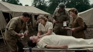 WWII field hospital: a nurse injects penicillin into a wounded soldier as doctors observe, showcasing its life-saving impact
