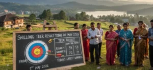 Teer Result Today on a black Board with people standing near the Black Board